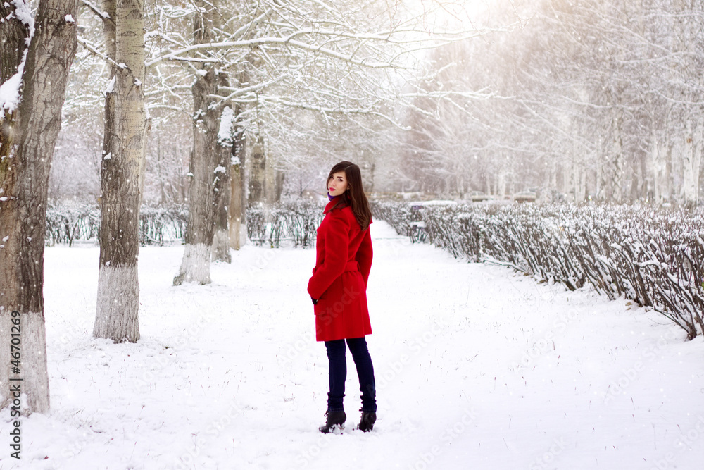 Beautiful elegant woman in red coat
