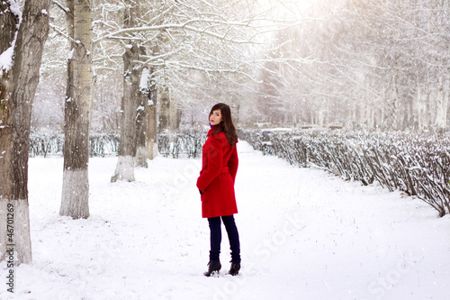 Beautiful elegant woman in red coat © Anton Maltsev