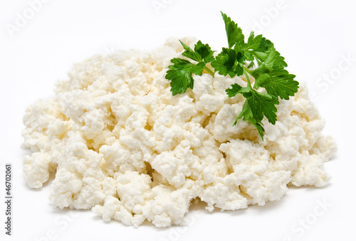 Heap of the fresh cottage cheese with parsley isolated