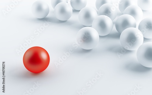 many white balls and one contrasting red