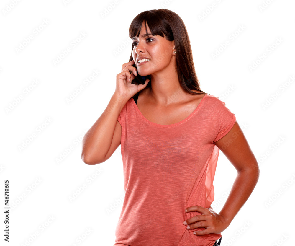 Charming young woman talking on cellphone Charming young woman talking on cellphone