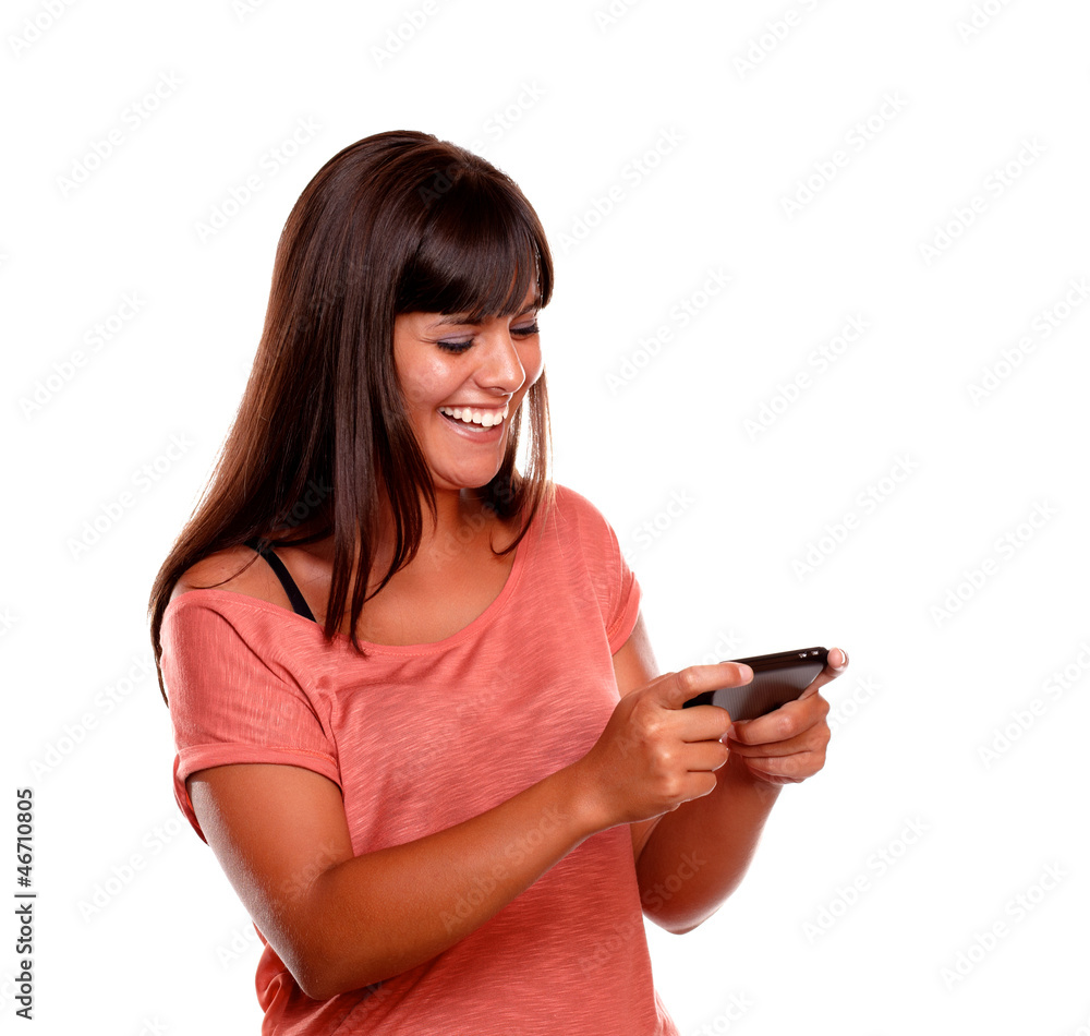 Charming young female sending message by cellphone Charming young female sending message by cellphone