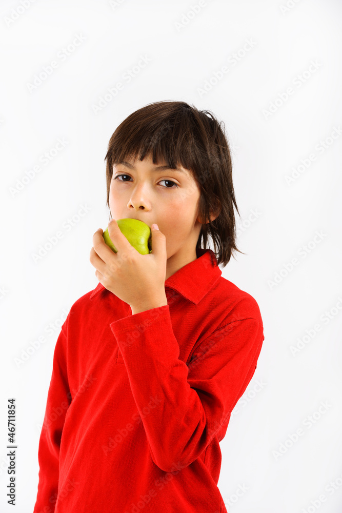 boy eating a green apple isolated on white background boy eating a green apple isolated on white background