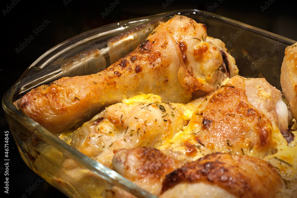 Fototapeta premium Chicken legs baked with mayonnaise and cheese