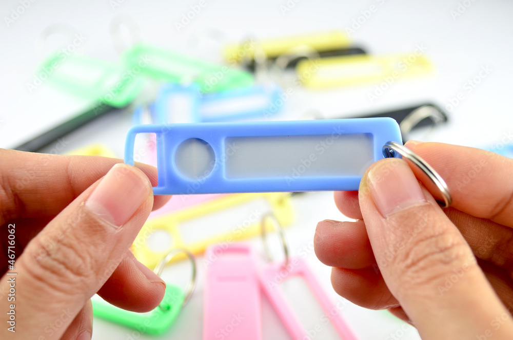 Hands holding key chain with space for text Hands holding key chain with space for text