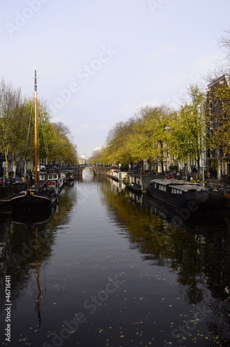 Canal and boats in old city of Amsterdam