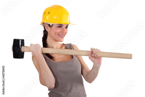 A female construction worker with a sledgehammer.