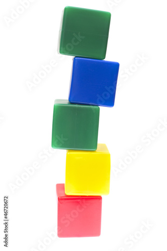 Children's pyramid from color cubes isolated on white background