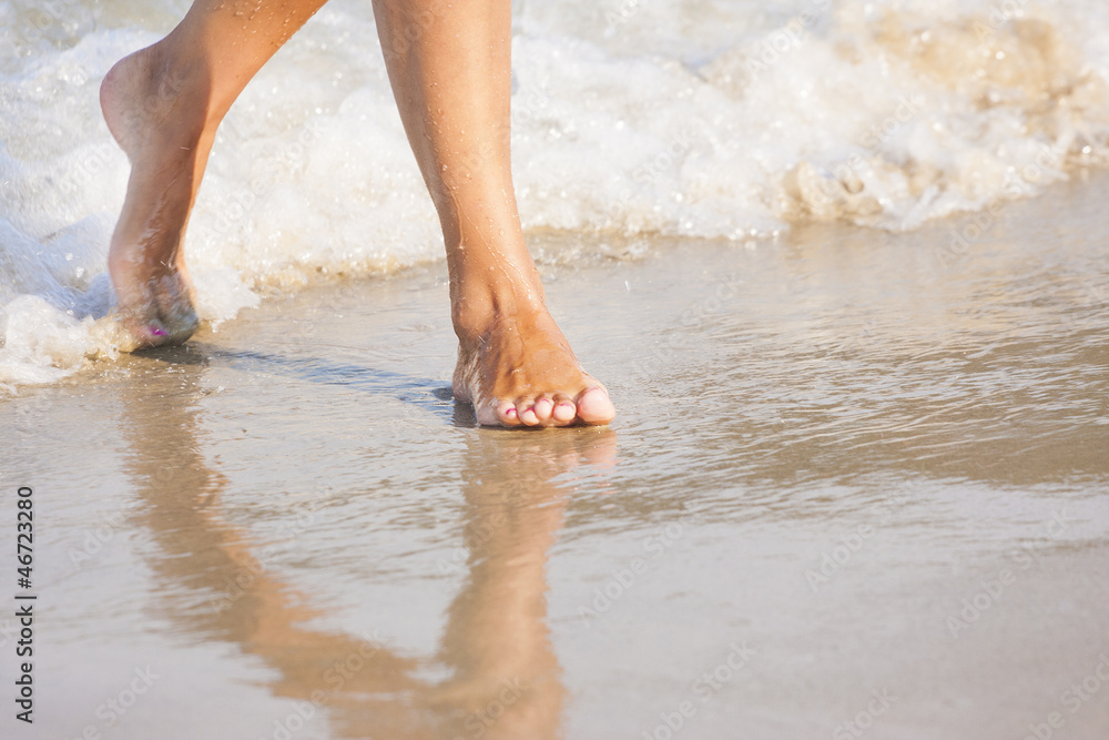nice legs of a girl walking in water nice legs of a girl walking in water