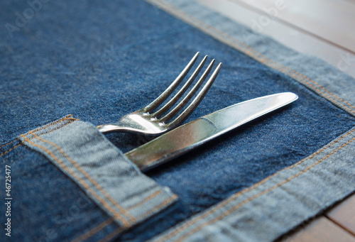 Knife and Fork placed in a jeans napkin' pocket