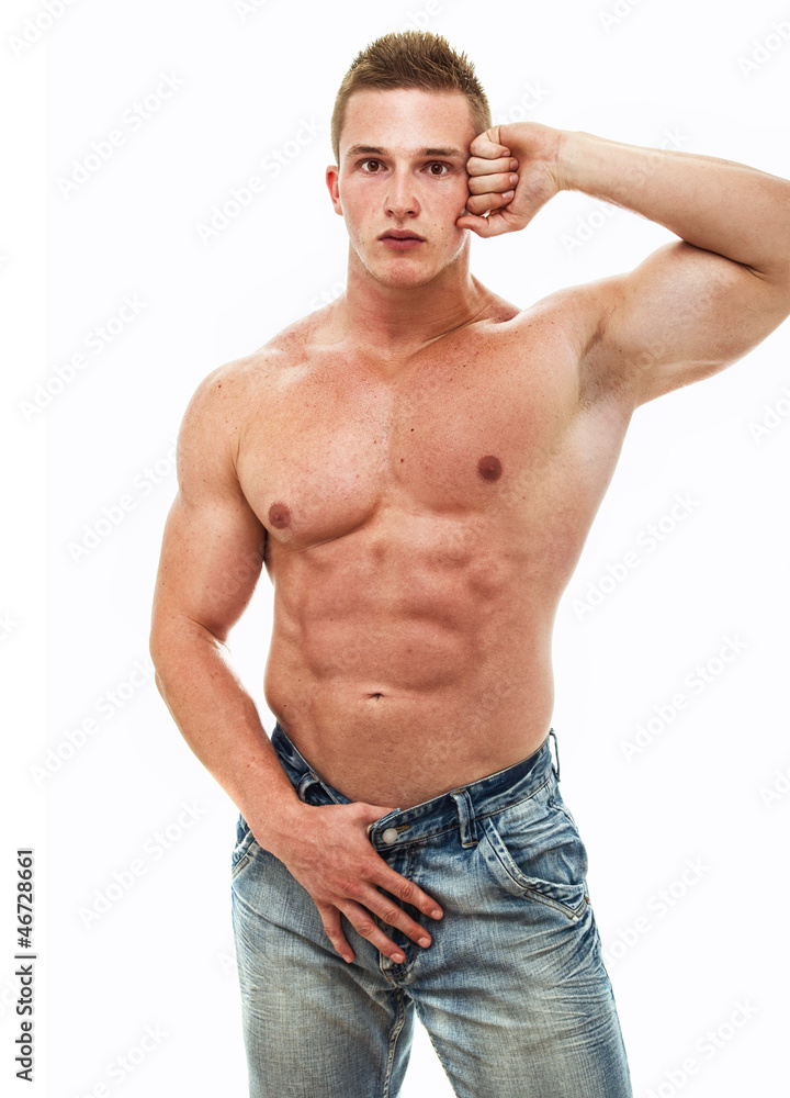 Muscular male torso of bodybuilder, studio shot Muscular male torso of bodybuilder, studio shot