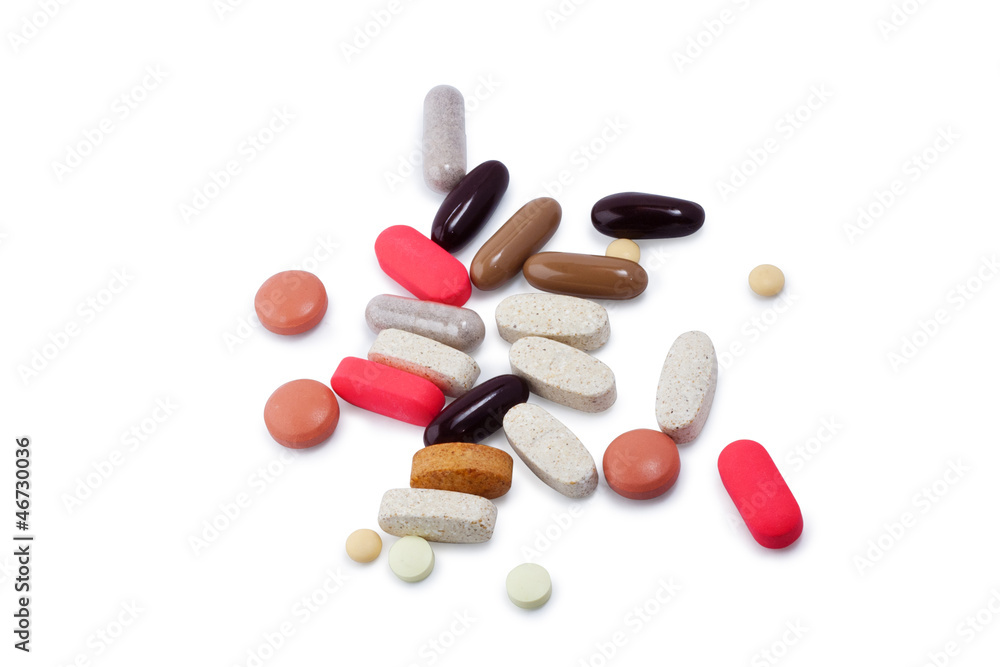 Assorted pills and supplements on white with clipping path Assorted pills and supplements on white with clipping path