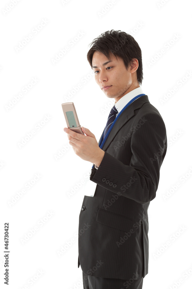 Young businessman working with mobile phone Young businessman working with mobile phone