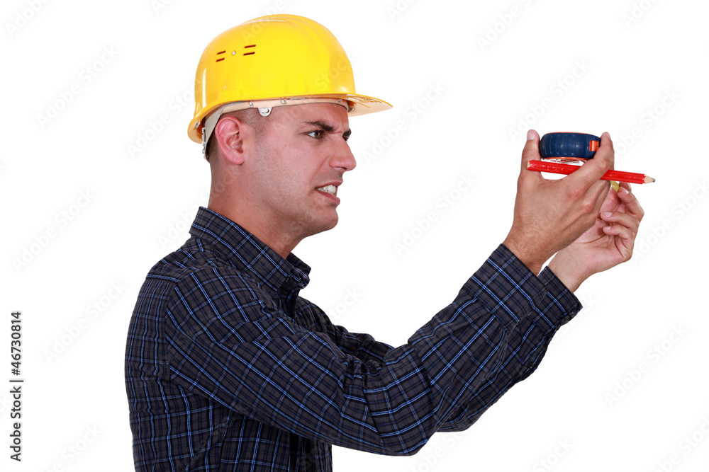 craftsman holding a meter and looking really displeased craftsman holding a meter and looking really displeased