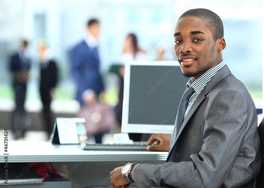 African American entrepreneur displaying computer African American entrepreneur displaying computer