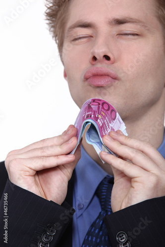 young man holding bank notes