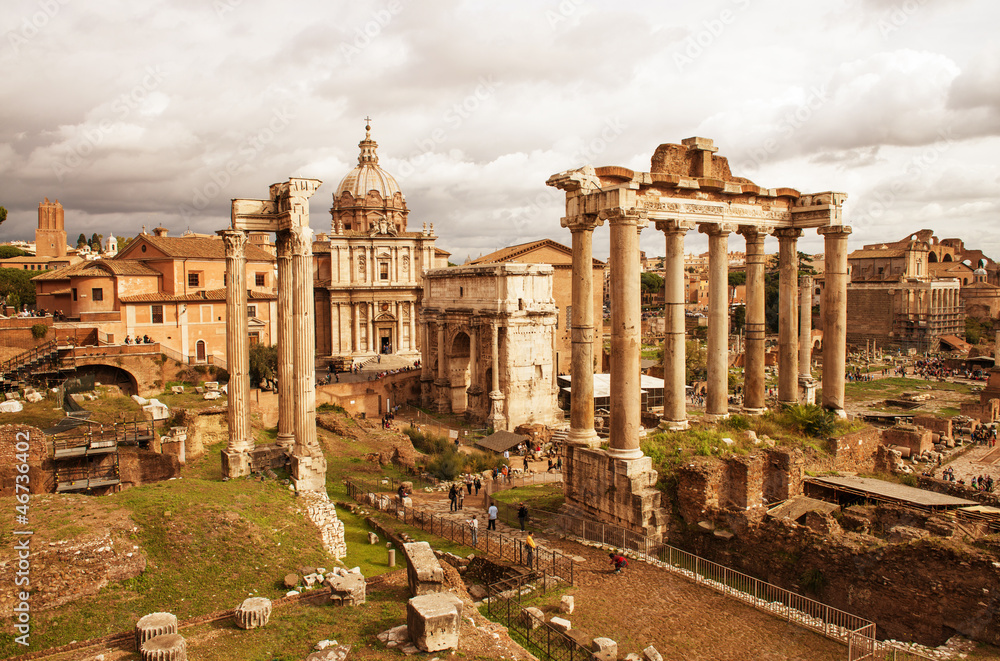 View of Roman Forum, focus on the Saturn's Temple in foreground.