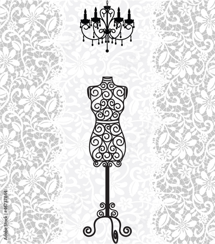 mannequin and chandelier on lace background