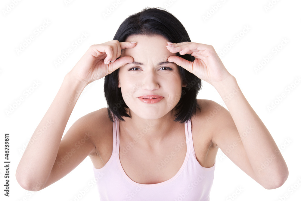 Beautiful shocked woman checking her wrinkles Beautiful shocked woman checking her wrinkles