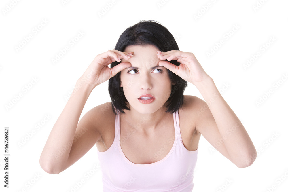 Beautiful shocked woman checking her wrinkles Beautiful shocked woman checking her wrinkles