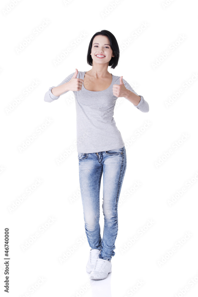 Beautiful young woman gesturing thumbs up. Beautiful young woman gesturing thumbs up.