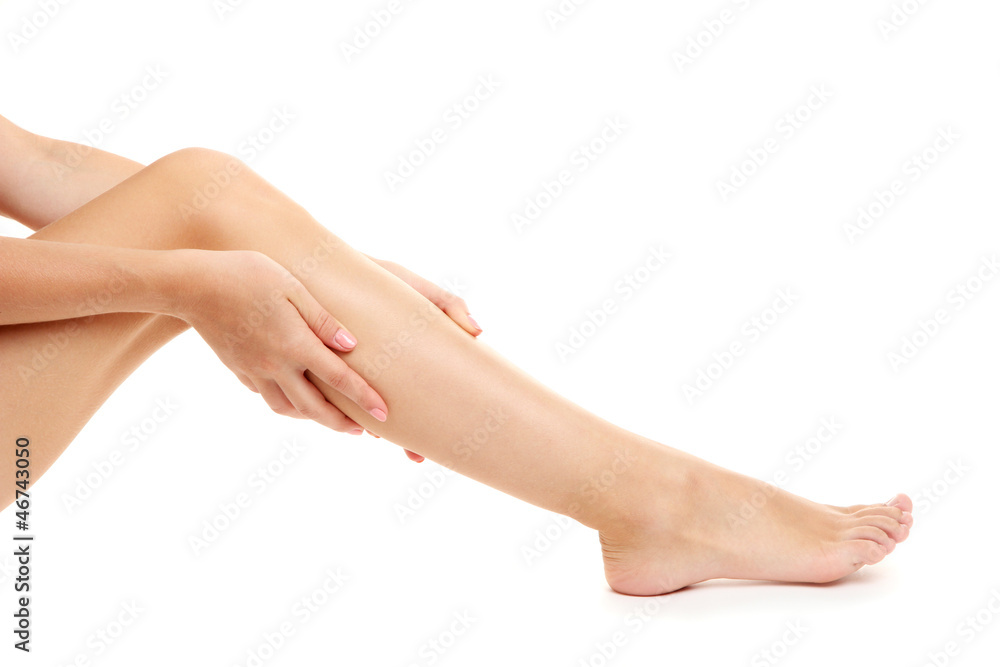 woman holding sore leg, isolated on white