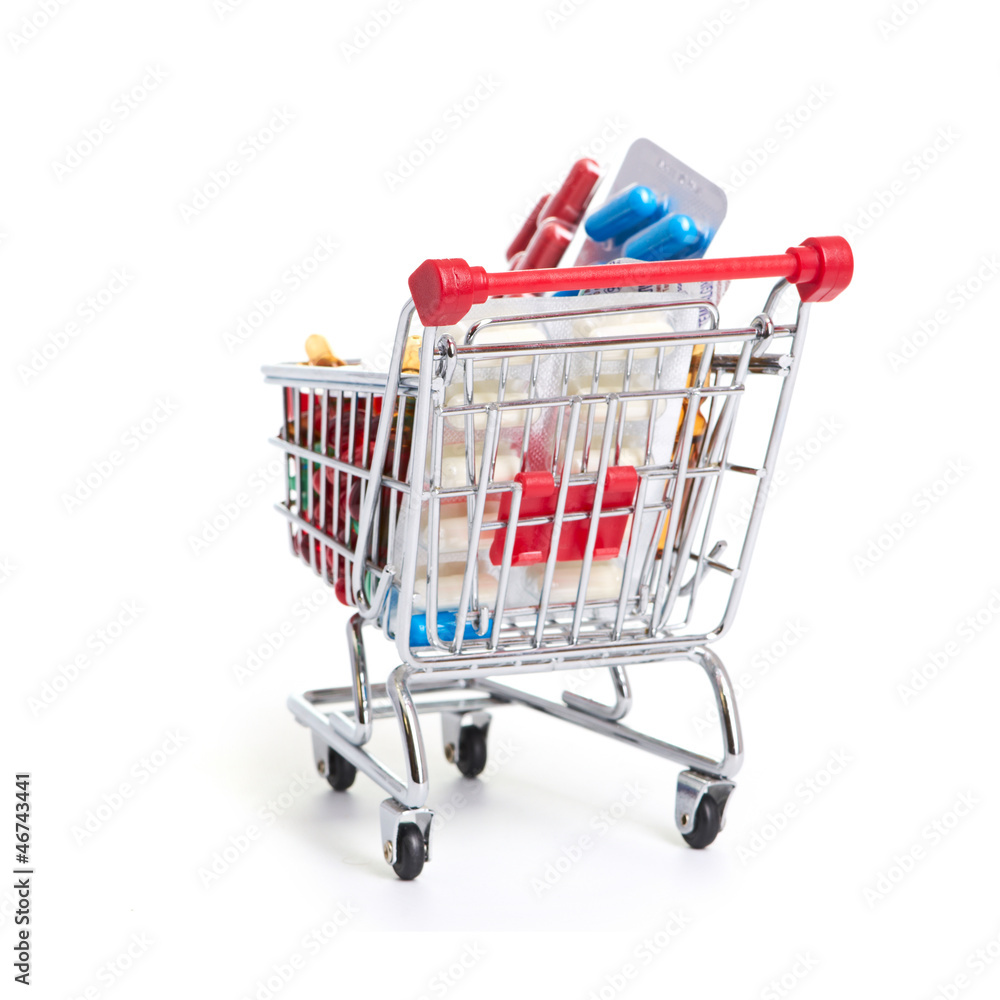 Fototapeta premium Shopping trolley with pills and medicine
