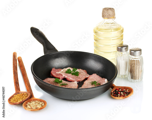 composition of raw meat and spices on white background close-up