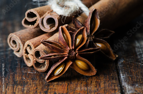 Star anise with cinnamon on wooden table close up