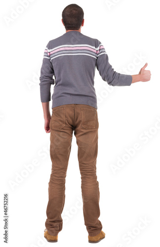 Back view of man shows thumbs up.