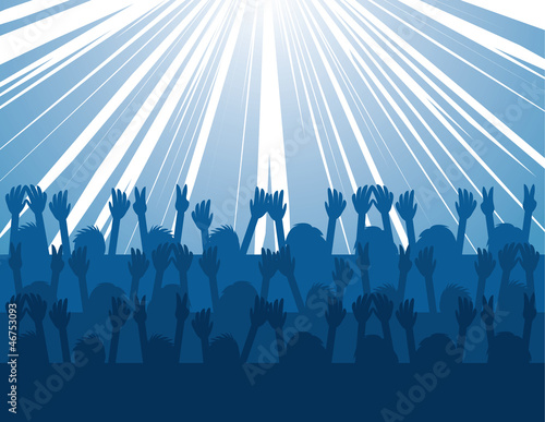 Audience silhouettes cheering at concert in blue