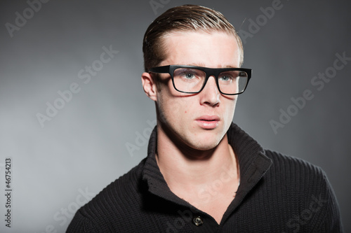 Fashion beauty portrait of young man with retro glasses.