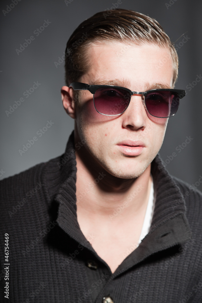 Fashion beauty portrait of young man with retro sunglasses. Fashion beauty portrait of young man with retro sunglasses.