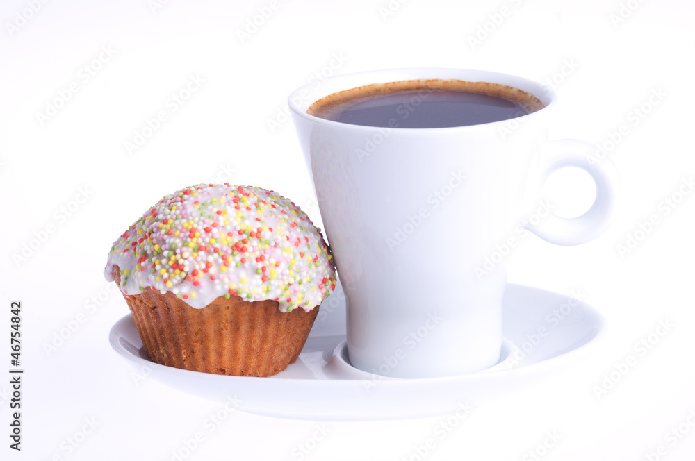 coffee with a cupcake with sprinkles on a saucer coffee with a cupcake with sprinkles on a saucer