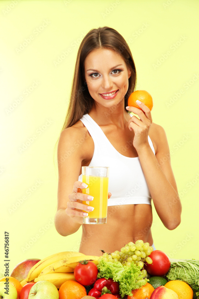 beautiful young woman with fruits and vegetables and glass of beautiful young woman with fruits and vegetables and glass of