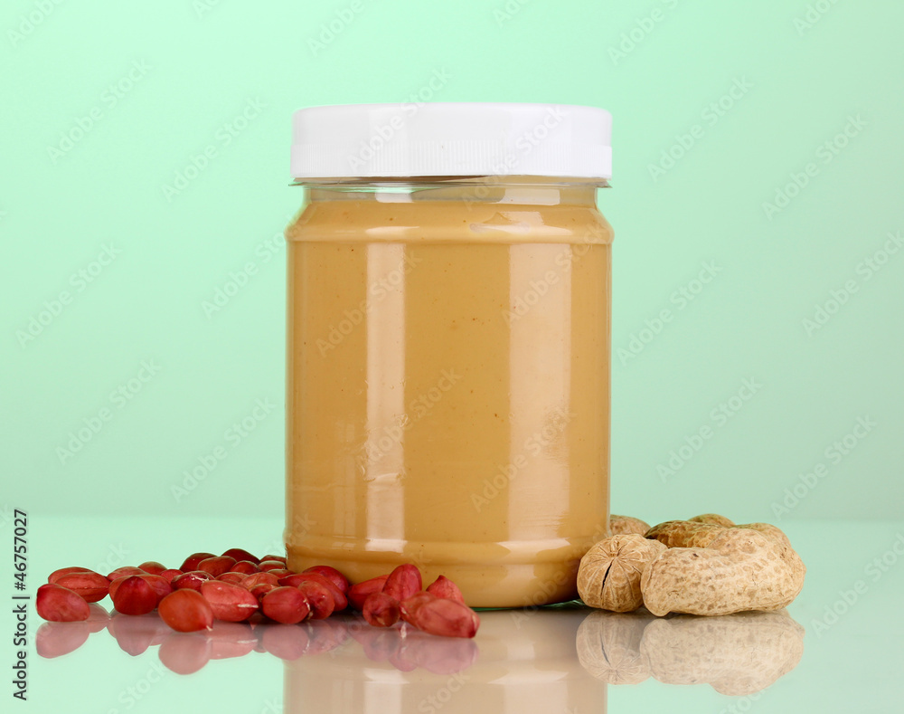 Delicious peanut butter in jar of peanut near Delicious peanut butter in jar of peanut near