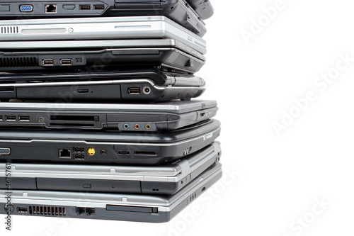 Laptop pile with copyspace, isolated on white