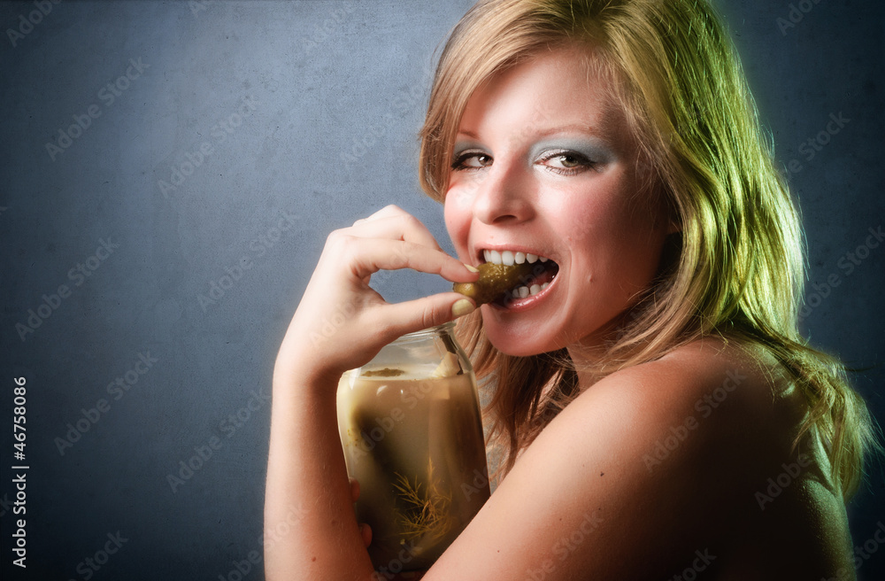 Closeup portrait of healthy young woman eating vegetable Closeup portrait of healthy young woman eating vegetable
