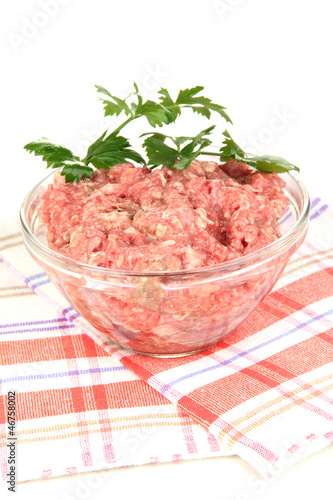 Bowl of raw ground meat isolated on white