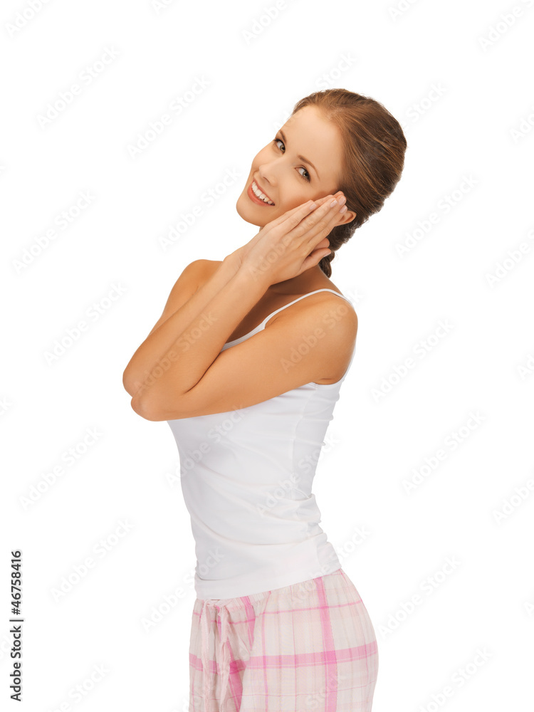 woman in cotton pajamas making sleeping gesture woman in cotton pajamas making sleeping gesture