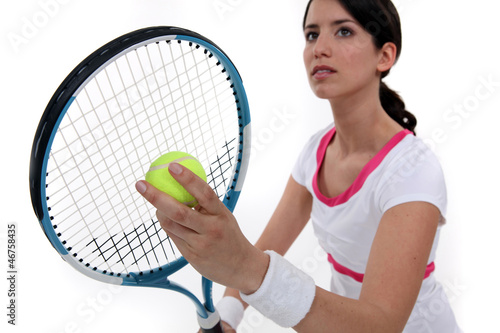 Tennis player about to serve © auremar
