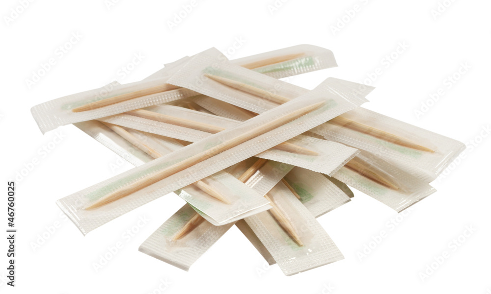 Wooden toothpicks in a package isolated on white background Wooden toothpicks in a package isolated on white background