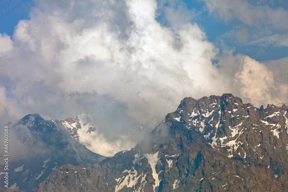 mountain peaks in the clouds, Switzerland. mountain peaks in the clouds, Switzerland.