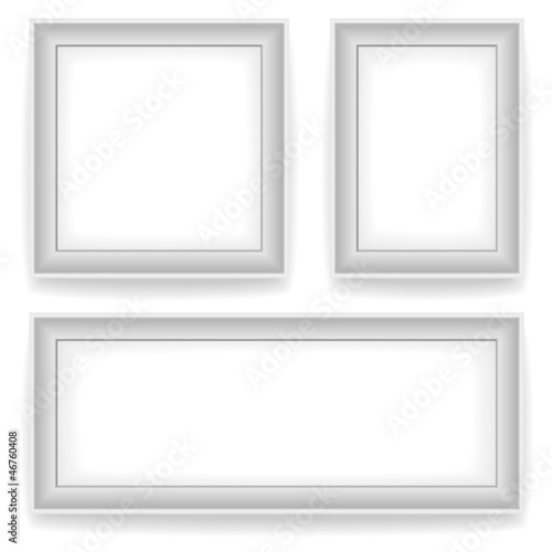 Blank white wall picture frames isolated on white