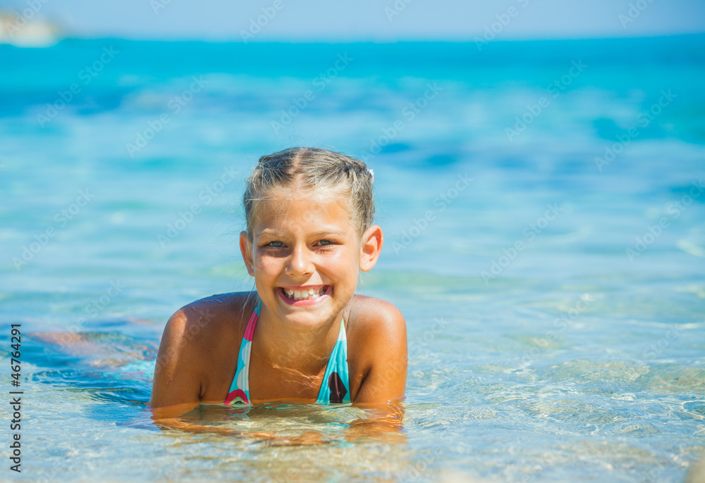 Young girl playing in the sea Young girl playing in the sea