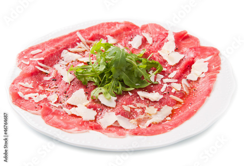 carpaccio of beef on arugula