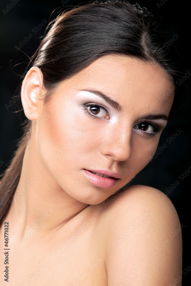 A portrait of a beautiful woman isolated on black background A portrait of a beautiful woman isolated on black background