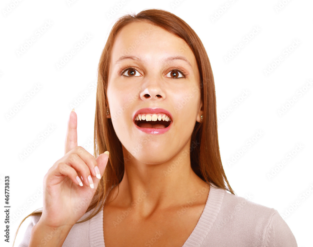 Portrait of a smiling young woman pointing up Portrait of a smiling young woman pointing up