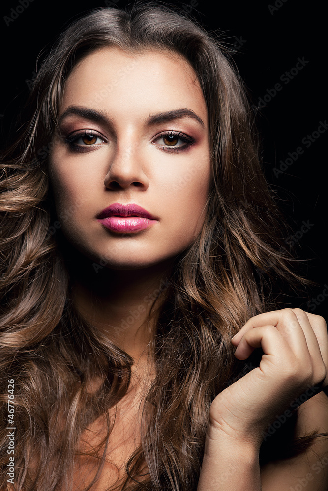 Fototapeta premium attractive woman with long curly hair