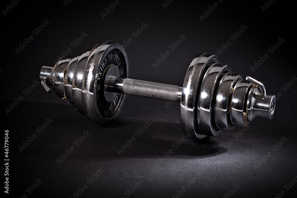 dumbbell on black background dumbbell on black background